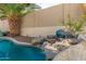 Relaxing pool with waterfall feature and spacious patio at 959 W Myrtle Dr, Chandler, AZ 85248