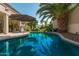 Inviting pool with a large patio and palm trees at 959 W Myrtle Dr, Chandler, AZ 85248