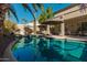 Large pool with a covered patio and seating area at 959 W Myrtle Dr, Chandler, AZ 85248