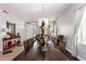 Bright dining room with wooden table and entryway view at 959 W Myrtle Dr, Chandler, AZ 85248