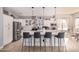 Modern kitchen with white cabinets, a large island, and stainless steel appliances at 959 W Myrtle Dr, Chandler, AZ 85248