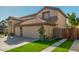 Two-story house with a three-car garage and wooden gate at 959 W Myrtle Dr, Chandler, AZ 85248