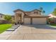 Two-story house with a three-car garage and landscaped lawn at 959 W Myrtle Dr, Chandler, AZ 85248