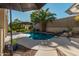 Relaxing kidney-shaped swimming pool with a rock waterfall feature at 959 W Myrtle Dr, Chandler, AZ 85248