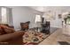 Elegant dining area with a wooden table and area rug at 959 W Myrtle Dr, Chandler, AZ 85248