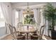 Cozy breakfast nook with a round table and view of the backyard at 959 W Myrtle Dr, Chandler, AZ 85248