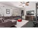 Spacious living room with a sectional sofa and home gym at 959 W Myrtle Dr, Chandler, AZ 85248