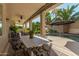 Inviting pool area with a large table and chairs under a covered patio at 959 W Myrtle Dr, Chandler, AZ 85248