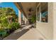Covered patio with ceiling fans and lush landscaping at 959 W Myrtle Dr, Chandler, AZ 85248