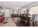 Open dining area with a wooden table and access to living areas at 959 W Myrtle Dr, Chandler, AZ 85248