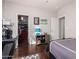 Spacious bedroom with dark wood floors, a walk-in closet and a comfortable bed at 959 W Myrtle Dr, Chandler, AZ 85248