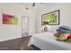 Spacious bedroom with dark wood floors and access to a bathroom at 959 W Myrtle Dr, Chandler, AZ 85248
