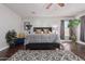 Main bedroom with dark wood floors, ceiling fan, and large windows at 959 W Myrtle Dr, Chandler, AZ 85248