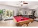 Game room features a pool table, backyard access, and comfortable seating at 959 W Myrtle Dr, Chandler, AZ 85248