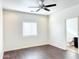 Bedroom with dark wood floors and ceiling fan at 8940 W Olive Ave # 134, Peoria, AZ 85345