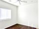 Simple bedroom with wood floor, ceiling fan and window blinds at 8940 W Olive Ave # 134, Peoria, AZ 85345