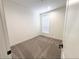Bright bedroom with gray carpet and neutral walls at 310 N Brower Rd, Maricopa, AZ 85139