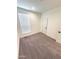 Spacious bedroom featuring gray carpet and neutral walls at 310 N Brower Rd, Maricopa, AZ 85139