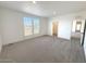 Large bedroom with gray carpet and neutral walls at 310 N Brower Rd, Maricopa, AZ 85139