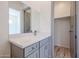 Bathroom with gray vanity, quartz countertop and closet at 14914 E Zapata Dr, Fountain Hills, AZ 85268