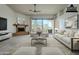 Bright living room features a fireplace and sliding glass doors leading to a patio at 18533 E Paseo Verde Dr, Rio Verde, AZ 85263