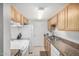 Kitchen with white appliances and wood cabinets at 600 S Dobson Rd # 18, Mesa, AZ 85202