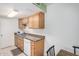 Efficient kitchen featuring wood cabinets, granite countertops, and modern appliances at 600 S Dobson Rd # 18, Mesa, AZ 85202