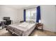 Bright bedroom with double bed, window coverings, and workspace at 600 S Dobson Rd # 18, Mesa, AZ 85202