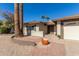 Landscaped front yard with brick walkway, potted plants, and double doors at 1612 E Julie Dr, Tempe, AZ 85283