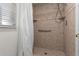 Clean shower with neutral tile and grab bar at 1612 E Julie Dr, Tempe, AZ 85283