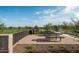 Brick paved patio with seating and a view of the community green space at 25912 N 22Nd Ln, Phoenix, AZ 85085