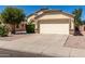 Front view of a single-story house with a two-car garage at 2091 N Coronado Ct, Casa Grande, AZ 85122