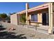 Private backyard with a covered patio and gravel at 4901 E Magic Stone Dr, Phoenix, AZ 85044