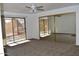 Bedroom with mirrored closet doors and access to a patio at 4901 E Magic Stone Dr, Phoenix, AZ 85044