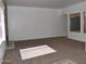 Spacious living room with ample natural light and carpet flooring at 4901 E Magic Stone Dr, Phoenix, AZ 85044