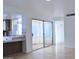 Bright kitchen with wood cabinets and access to a sunroom at 4901 E Magic Stone Dr, Phoenix, AZ 85044