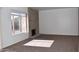 Living room featuring a brick fireplace and large window at 4901 E Magic Stone Dr, Phoenix, AZ 85044