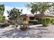 House exterior showcasing desert landscaping and a two-car garage at 4901 E Magic Stone Dr, Phoenix, AZ 85044