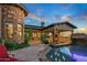 Relaxing spa and pool area with outdoor kitchen at 10612 E Winter Sun Dr, Scottsdale, AZ 85262