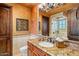 Bathroom with granite vanity and walk-in shower at 10612 E Winter Sun Dr, Scottsdale, AZ 85262