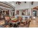 Game room features a game table and bar with seating at 10612 E Winter Sun Dr, Scottsdale, AZ 85262