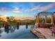 Expansive pool and spa with sunset views at 10612 E Winter Sun Dr, Scottsdale, AZ 85262