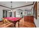 Game room featuring a pool table, wet bar, and comfortable seating area at 10612 E Winter Sun Dr, Scottsdale, AZ 85262