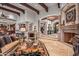 Spacious living room features a fireplace and views into the kitchen and dining area at 10612 E Winter Sun Dr, Scottsdale, AZ 85262