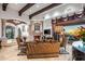 Living room boasts a fireplace, large windows with sunset views, and comfortable seating at 10612 E Winter Sun Dr, Scottsdale, AZ 85262