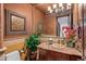 Upscale bathroom with granite vanity and decorative framed wall art at 10612 E Winter Sun Dr, Scottsdale, AZ 85262
