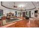 Spacious main bedroom with hardwood floors, fireplace, and sitting area at 10612 E Winter Sun Dr, Scottsdale, AZ 85262