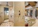Spa-like bathroom with a large walk-in shower and multiple shower heads at 10612 E Winter Sun Dr, Scottsdale, AZ 85262