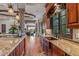 Kitchen features a farmhouse sink, granite countertops, and custom cabinetry at 10612 E Winter Sun Dr, Scottsdale, AZ 85262