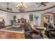 Opulent main bedroom featuring a comfortable sitting area and hardwood floors at 10612 E Winter Sun Dr, Scottsdale, AZ 85262